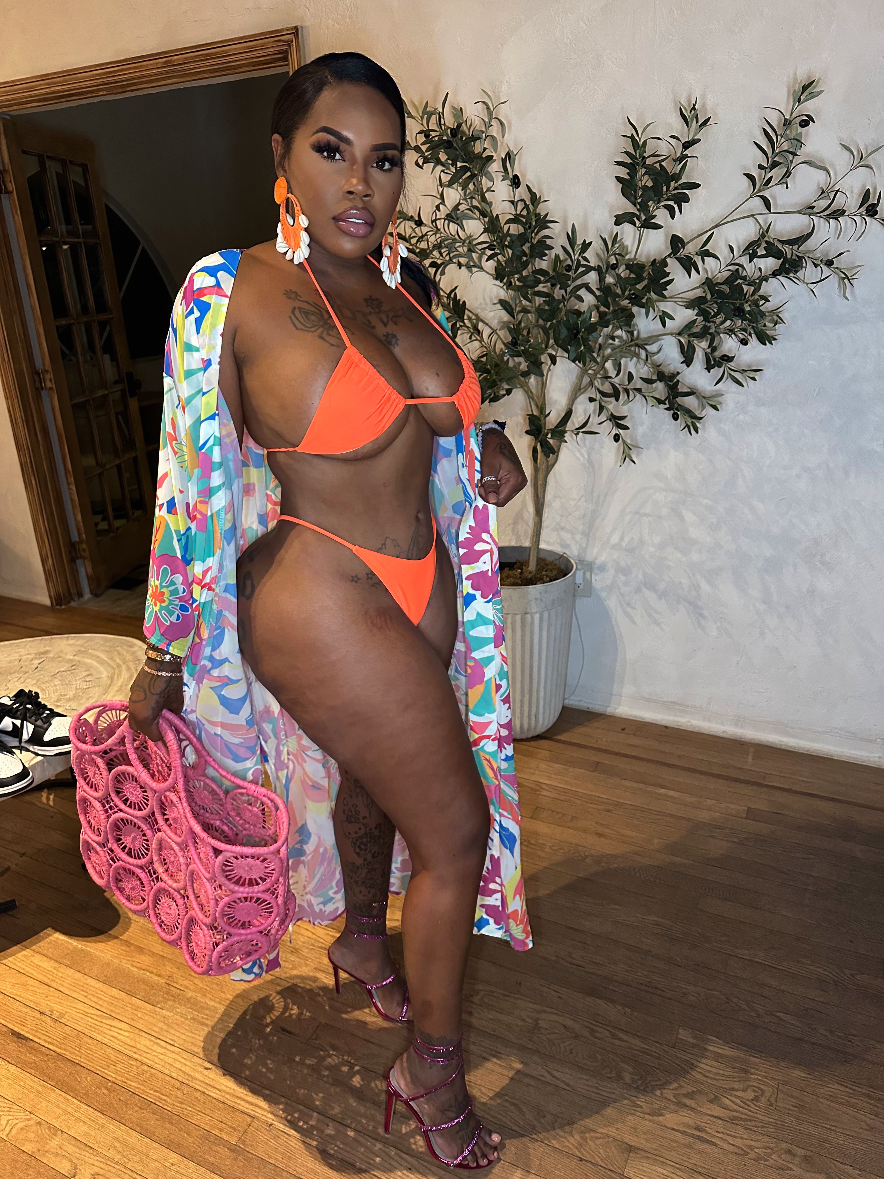 Bright orange thong swimsuit only